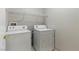 Convenient laundry room featuring a washer, dryer, and ample storage shelving at 8250 N Grand Canyon Dr # 1123, Las Vegas, NV 89166