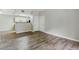Inviting living room with wood-look floors and a view of the kitchen area at 8250 N Grand Canyon Dr # 1123, Las Vegas, NV 89166