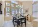 Bright dining area with a view of the backyard and access to an outdoor dining space at 8320 Opal Cove Dr, Las Vegas, NV 89128