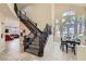 Inviting entryway features a staircase, high ceilings, and elegant dining space at 8320 Opal Cove Dr, Las Vegas, NV 89128
