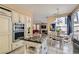 Open kitchen has a center island, stainless appliances, and adjacent dining area at 8320 Opal Cove Dr, Las Vegas, NV 89128