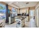 A chef's kitchen featuring stainless appliances, granite counters, and a center island at 8320 Opal Cove Dr, Las Vegas, NV 89128
