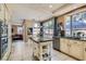 Spacious kitchen offers a center island, ample cabinetry, and bright natural light at 8320 Opal Cove Dr, Las Vegas, NV 89128