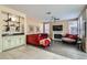 This is a bright living room with a fireplace, wine bar and lots of natural light at 8320 Opal Cove Dr, Las Vegas, NV 89128