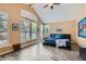Spacious main bedroom features vaulted ceilings, large windows, and light hardwood floors at 8320 Opal Cove Dr, Las Vegas, NV 89128
