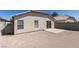 View of the house and backyard with a block wall and patio space at 8877 Perfect Diamond Ct, Las Vegas, NV 89129