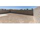 Fully-enclosed backyard with gravel and a concrete patio area at 8877 Perfect Diamond Ct, Las Vegas, NV 89129