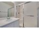Bathroom showcasing a sink and enclosed shower with sliding doors at 8877 Perfect Diamond Ct, Las Vegas, NV 89129