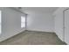 Bedroom featuring neutral walls, gray carpet, natural light, and a closet at 8877 Perfect Diamond Ct, Las Vegas, NV 89129