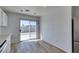 Bright dining space includes wood floors and sliding glass door to backyard patio at 8877 Perfect Diamond Ct, Las Vegas, NV 89129