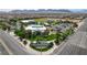 A beautiful aerial view of Skye Canyon Park with lush landscaping, trees, and ample parking at 8898 Sasquatch Run Ave, Las Vegas, NV 89166