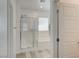 Modern bathroom with a glass-enclosed shower and soaking tub, showcasing a bright and airy design at 8898 Sasquatch Run Ave, Las Vegas, NV 89166