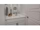 Bright bathroom with a modern single sink vanity and decor at 8898 Sasquatch Run Ave, Las Vegas, NV 89166