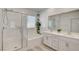 Elegant bathroom featuring a walk-in shower, a soaking tub, and double vanity sinks at 8898 Sasquatch Run Ave, Las Vegas, NV 89166