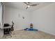 Bright bedroom offers neutral colors, a ceiling fan, and space for a desk, yoga mat, or extra furniture at 8898 Sasquatch Run Ave, Las Vegas, NV 89166
