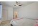 Well-lit bedroom featuring a ceiling fan, closet, and an ensuite bathroom at 8898 Sasquatch Run Ave, Las Vegas, NV 89166
