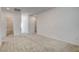 Spacious bonus room with carpet floors, and doors leading to the bathroom at 8898 Sasquatch Run Ave, Las Vegas, NV 89166