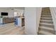 Open floor plan featuring kitchen with center island, living room and a stairway at 8898 Sasquatch Run Ave, Las Vegas, NV 89166