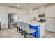 Modern kitchen with stainless steel appliances, a large island, and white cabinets at 8898 Sasquatch Run Ave, Las Vegas, NV 89166