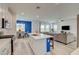 Open concept kitchen connecting to the dining and living areas, featuring a large island at 8898 Sasquatch Run Ave, Las Vegas, NV 89166