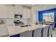 Spacious kitchen featuring stainless steel appliances, and an island with seating at 8898 Sasquatch Run Ave, Las Vegas, NV 89166