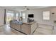 Large living room with a comfortable couch and great natural light at 8898 Sasquatch Run Ave, Las Vegas, NV 89166