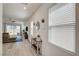 Bright living room with wood floors, large windows, and a view to the backyard at 8898 Sasquatch Run Ave, Las Vegas, NV 89166