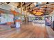 Spacious community lounge area with wood floors, comfortable seating, and modern design elements at 8898 Sasquatch Run Ave, Las Vegas, NV 89166