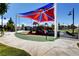 Community playground with play structures, shaded areas, and lush surroundings for enjoyment at 8898 Sasquatch Run Ave, Las Vegas, NV 89166
