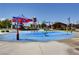 Fun community splash pad with playful water features, colorful structures, and shaded areas for enjoyment at 8898 Sasquatch Run Ave, Las Vegas, NV 89166