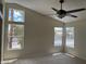 Bright bedroom with a ceiling fan and three windows letting in natural light at 9004 Dulcimer Ln, Las Vegas, NV 89123
