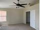 Comfortable bedroom features a ceiling fan and a closet with sliding doors at 9004 Dulcimer Ln, Las Vegas, NV 89123
