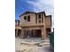 Exterior view of a new home under construction with wood framing and a two-car garage at 9094 Rivington Ave, Las Vegas, NV 89148