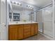This bathroom features a double sink vanity and a shower with a glass enclosure at 9218 Grassy Weep Ct, Las Vegas, NV 89178