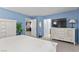 Primary bedroom featuring blue walls, carpet and a white paneled bed at 9218 Grassy Weep Ct, Las Vegas, NV 89178