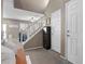 Inviting entryway with tile floors, a staircase, and a view into the open living area at 9218 Grassy Weep Ct, Las Vegas, NV 89178
