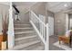 Carpeted staircase with white railing, leading to the upper level of the home at 9218 Grassy Weep Ct, Las Vegas, NV 89178