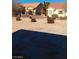Backyard featuring low-maintenance desert landscaping, rock features, and stone pathway at 9312 Yucca Blossom Dr, Las Vegas, NV 89134