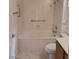 Bright bathroom features a bathtub with white tile surround, shower, and updated fixtures at 9312 Yucca Blossom Dr, Las Vegas, NV 89134