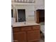Bathroom featuring a vanity with storage, a sink, mirror, and accent lighting at 9312 Yucca Blossom Dr, Las Vegas, NV 89134