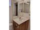 Vanity features a sink with storage, modern faucet, and a large, bright mirror at 9312 Yucca Blossom Dr, Las Vegas, NV 89134