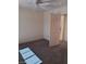 Bright bedroom with neutral walls, ceiling fan, and a light-colored door at 9312 Yucca Blossom Dr, Las Vegas, NV 89134
