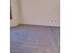 Neutral carpeted bedroom with a window and neutral colored walls at 9312 Yucca Blossom Dr, Las Vegas, NV 89134