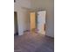 Carpeted bedroom with access to a walk-in closet and a full bathroom at 9312 Yucca Blossom Dr, Las Vegas, NV 89134