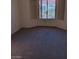 Carpeted bedroom with a bay window that provides lots of natural light at 9312 Yucca Blossom Dr, Las Vegas, NV 89134