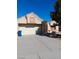 Charming single-story home featuring a two-car garage and a well-maintained gravel yard at 9312 Yucca Blossom Dr, Las Vegas, NV 89134