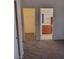 Hallway view of walk in closet and a bathroom with vanity and modern lighting at 9312 Yucca Blossom Dr, Las Vegas, NV 89134