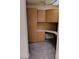A home office with an integrated desk, overhead cabinets, and carpeted floors, creating a functional workspace at 9312 Yucca Blossom Dr, Las Vegas, NV 89134