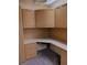 An organized home office featuring built-in cabinets, a spacious desk, and carpeted flooring for added comfort at 9312 Yucca Blossom Dr, Las Vegas, NV 89134