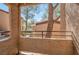 Exterior balcony offers treetop views and a relaxing outdoor space with sturdy railings at 9325 W Desert Inn Rd # 120, Las Vegas, NV 89117